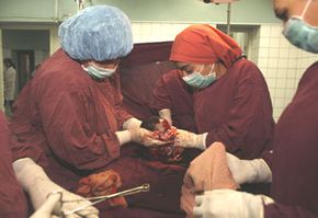A baby is born by C-section in Kabul, Afghanistan, in October 2007. See more pregnancy pictures.
