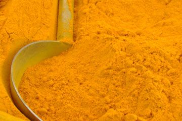 Abstract image of Indian turmeric powder from vegetable market.