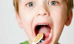 boy brushing teeth and mouth