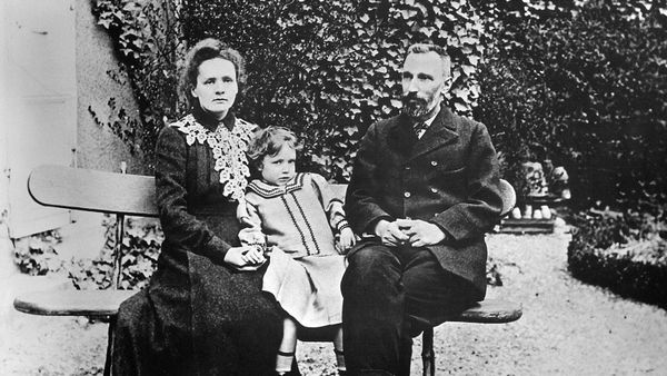 Family of men and child outdoors in black and white.