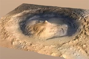 这是好奇号降落的盖尔陨石坑的视图。请注意，这位艺术家的概念有一个垂直的夸张，让人们更好地了解该地区的地形。