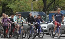 Person cycling outdoors for leisure on bicycle.