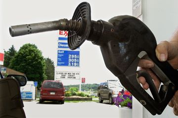 A customer prepares to fill his car with gas at a station in Zelienople. Pa.