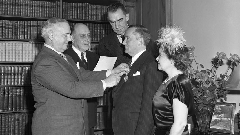 Bill Donovan, wartime chief of the Office of Strategic Services, pins a medal on William Stephenson, director of British Security Coordination. Bettmann/Getty Images