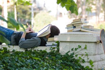 boy resting on college campus