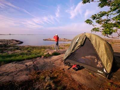 Person exploring nature's outdoor adventure as a tourist.