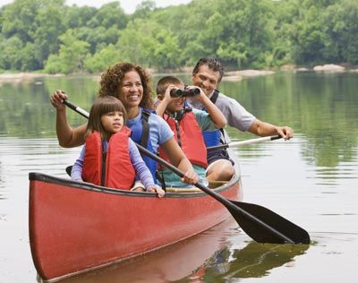 Girls explore nature at summer camp.