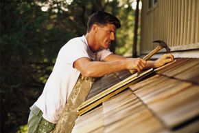 man fixing roof