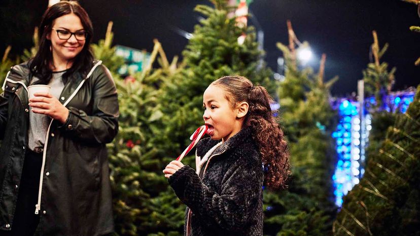 girl eating candy cane