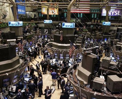 Traders work on the floor 