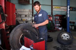 Mechanic balancing a tire