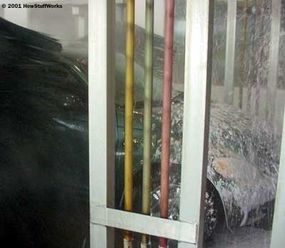 The wax foam is applied to the car in a heavy coating.