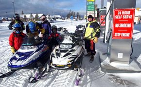 Even these snowmobile drivers know it's best to keep your gas tank full during the winter.