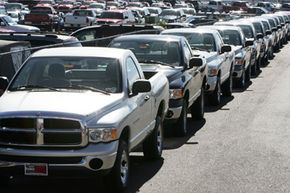 A long line of Dodge Ram pickup trucks sits on the lot of a Dodge dealership in Littleton, Colo.