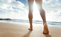 Person walking on beach. 