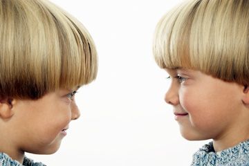 twin boys looking at each other