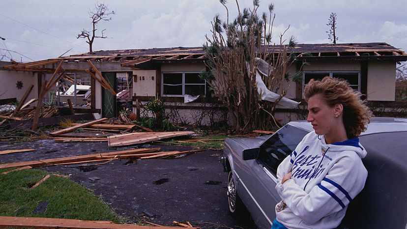 A young woman leans on a car during the aftermath of Hurricane Andrew in Miami. Andrew was a Category 5 hurricane that hit South Florida in 1992.  Steve Starr/CORBIS/Corbis via Getty Images