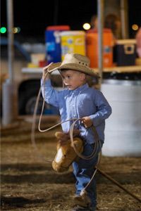 Boys rodeo outdoors, children only.