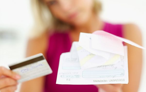 Woman reviewing credit card paperwork