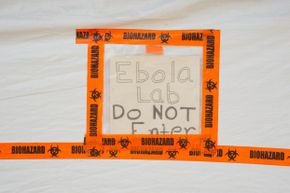 As this picture shows, the Centers for Disease Control and Prevention isn't just working with deadly agents at headquarters in Georgia. This sign sticks to the sample processing area of the CDC Ebola lab in Bo, Sierra Leone.