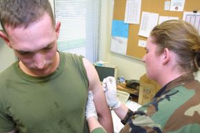 A U.S. Marine from Camp Pendleton receives his smallpox vaccination before heading out for active duty in the Persian Gulf.