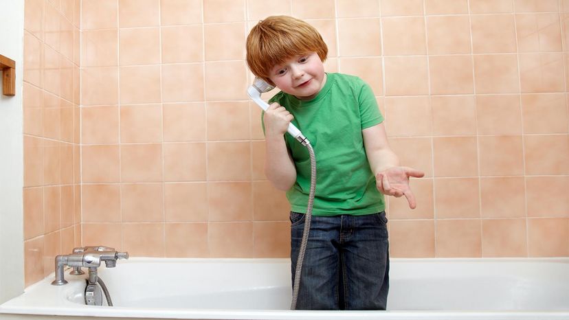 kid playing in shower
