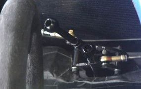 To the driver's left is a pair of levers -- these levers adjust the front and rear suspension. They stiffen and soften the chassis and are used by the driver as the fuel load changes.