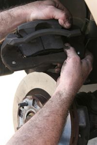 Inserting new brake pads