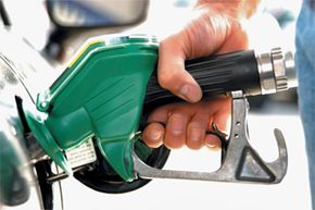 person filling up gas tank