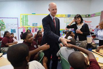 Florida Governor Rick Scott visits the Florida International Academy charter school.