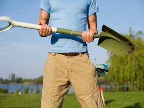 man holding shovel