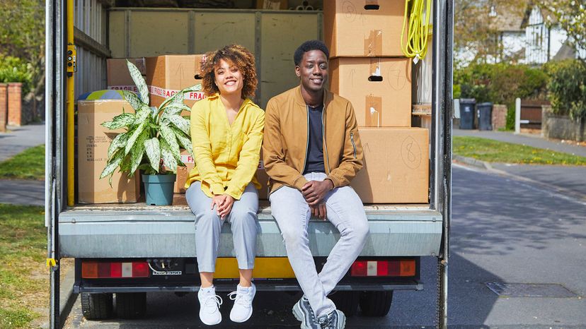 young couple in moving truck