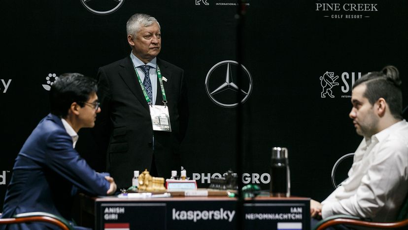 Anatoly Karpov, chess players Anish Giri and Ian Nepomniachtchi 