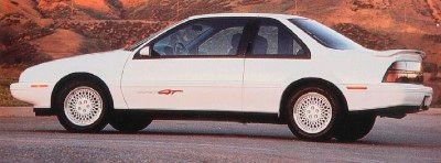 A white, 1991 Chevrolet Beretta.