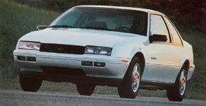 A white, 1992 Chevrolet Beretta.
