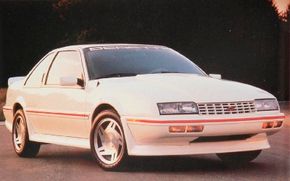 A white, 1988 Chevrolet Beretta.