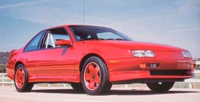 A red, 1990 Chevrolet Beretta.