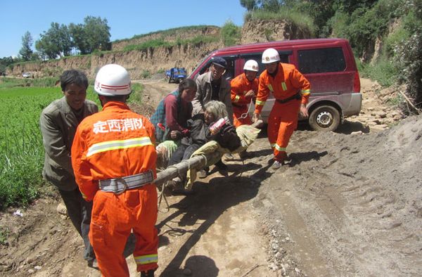 Men working outdoors as firefighters.