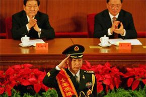 Yang Liwei, China's first astronaut in space, salutes before giving a speech during a 2007 meeting marking the 80th anniversary of the founding of the People's Liberation Army.