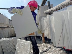 A local worker making drywall in Huzhu County of Qunghai Province, China. See more home construction pictures.