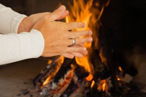 Warming hands by fire