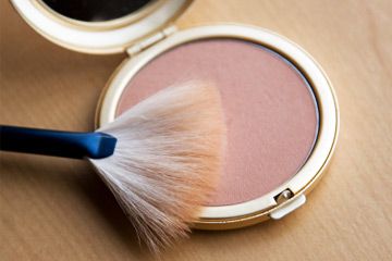 A soft bronzer with a fan brush for application