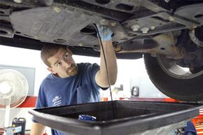 Automotive service technician Steve Loverme works on a vehicle at Bredemann Chevrolet in Park Ridge, Ill.