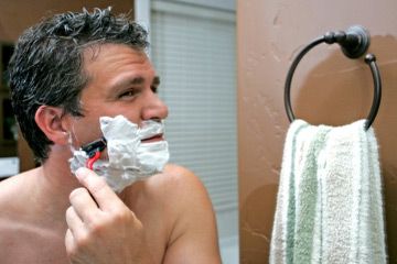 man shaving face