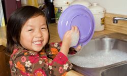 Your children may not like doing chores as much as this little cutie does, but they have to be responsible.