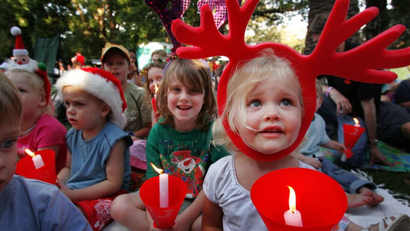 Australian children listen to Christmas carols.