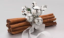 A silver bow turns cinnamon sticks into pretty décor.