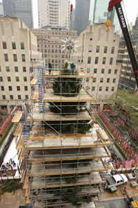 A giant crystal star is set into place atop Rockefeller Center Christmas tree in New York on Nov. 13, 2007.