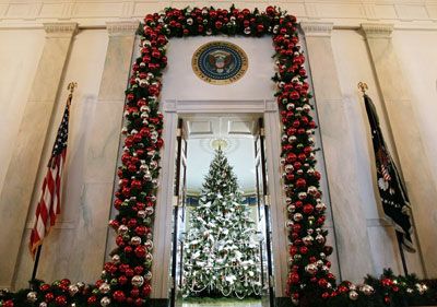 A holiday tree is seen in the Blue Room of the White House from the entrance during a media preview of the White House holiday decorations Nov. 30, 2006 in Washington, D.C. 