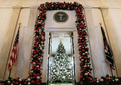 A holiday tree is seen in the Blue Room of the White House from the entrance during a media preview of the White House holiday decorations Nov. 30, 2006 in Washington, D.C.